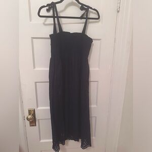 Navy blue cotton midi sundress with smocking and tie straps.